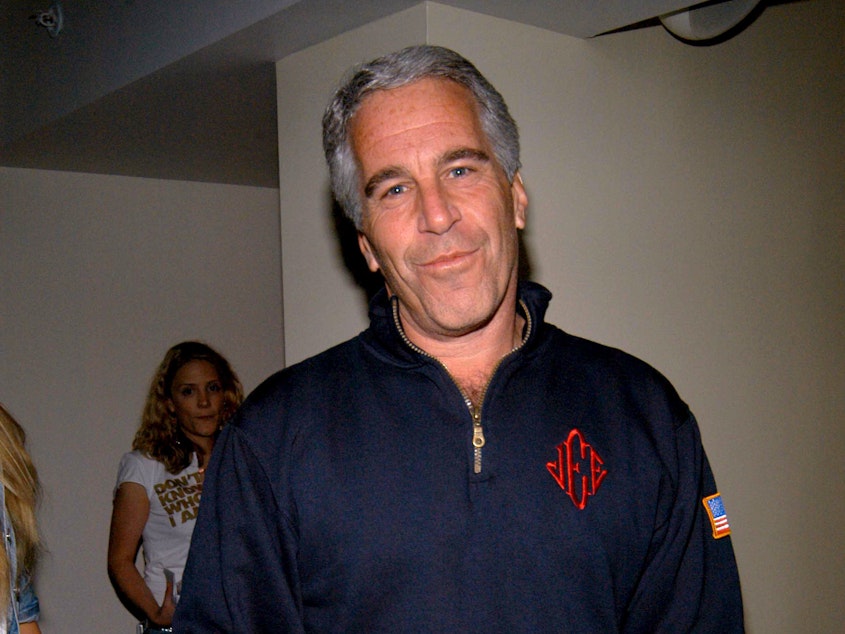 caption: Under a plea deal brokered in 2007, Jeffrey Epstein served just 13 months and was granted work release. He is seen here at a New York City event in 2005.