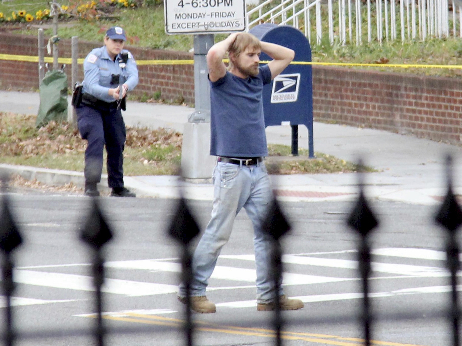 caption: Edgar Maddison Welch, of Salisbury, N.C., is shown surrendering to police, in Washington, D.C., on Dec. 4, 2016.