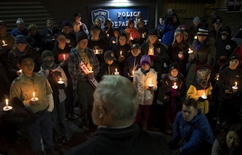 caption: Members of the DuPont community gather to listen to mayor Mike Courts during a candlelight vigil on Wednesday, December 20, 2017, at DuPont City Hall in DuPont.  Tap or click on the first image to see more. 