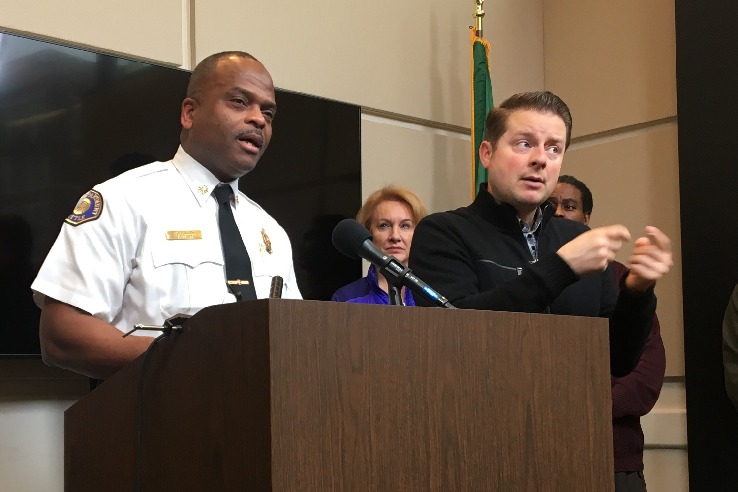 caption: Andy Gault (right) interprets an address from Seattle Fire Chief Harold Scoggins about the city's response to the snow weather, Jan. 14, 2020. 