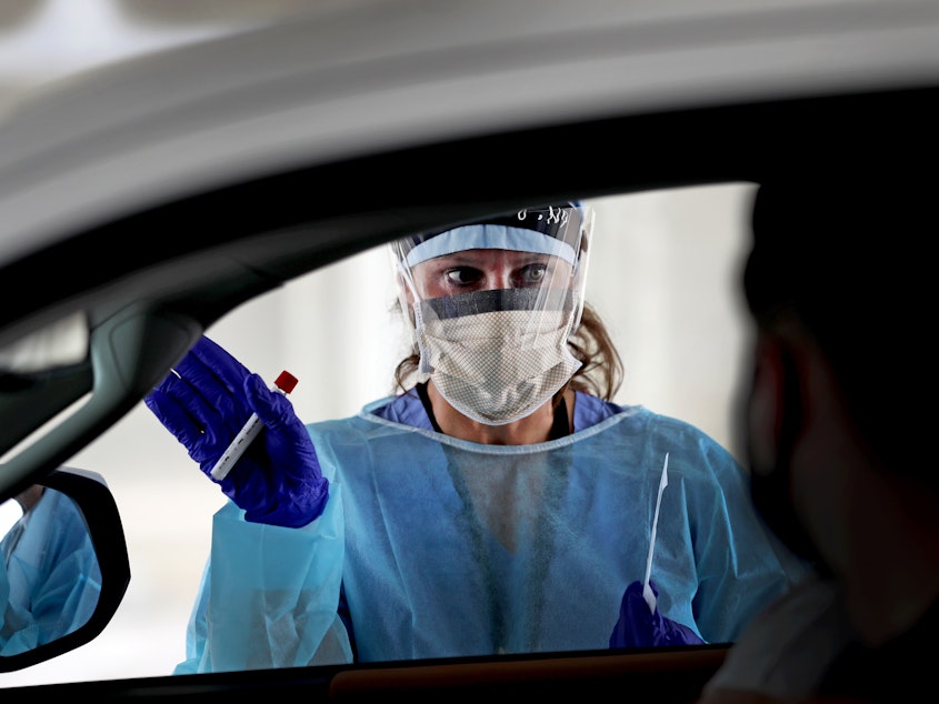 caption: Testing contacts of those with confirmed cases of the coronavirus is a common public health practice. New CDC guidelines make it optional.