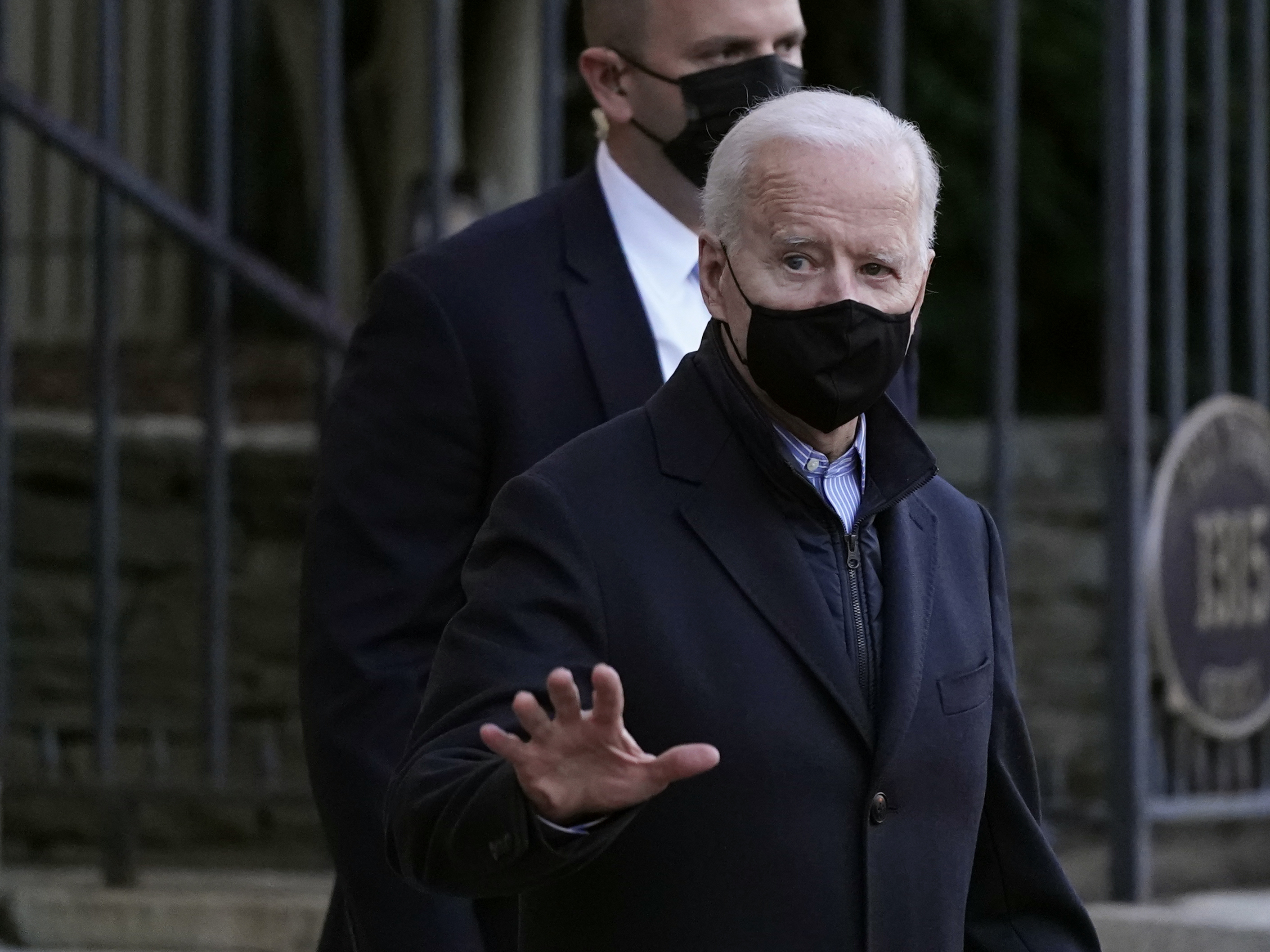 caption: President Biden departs after attending Mass on Saturday at Holy Trinity Catholic Church in Washington.