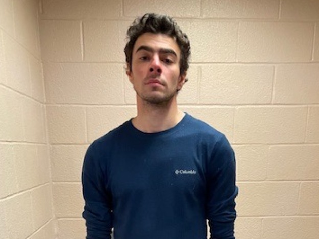 caption: In this handout photo released by the Altoona Police Department, Luigi Mangione is seen in a holding cell after being taken into custody on Dec. 9, 2024, in Altoona, Pa.