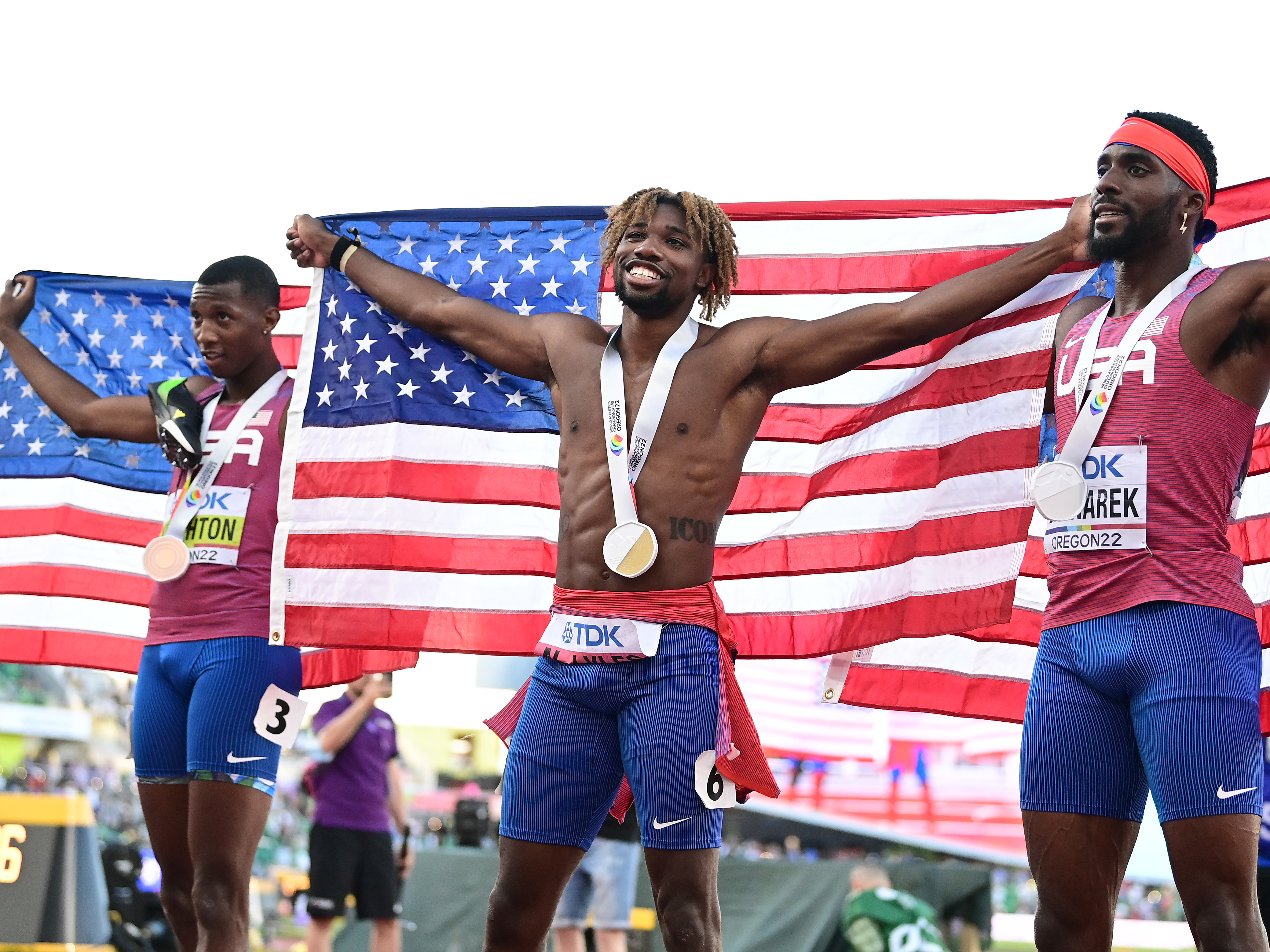 caption: The U.S. swept the men's 200m final at the World Athletics Championships at Hayward Field  in Eugene, Ore., with Noah Lyles setting a new U.S. record. At left is bronze medalist Erriyon Knighton; at right is silver medalist Kenneth Bednarek.