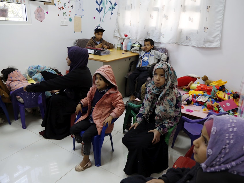 caption: Yemeni children diagnosed with cancer wait to receive treatment at an oncology ward of a hospital in Sana'a on February 4. A new study looks at the impact of COVID-19 on kids with cancer.