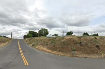 caption: The corner of Silver Lake and Medical Lake-Four Lakes roads in Spokane County, close to where a couple was arrested for breaking into a home that had been evacuated due to wildfire danger. 