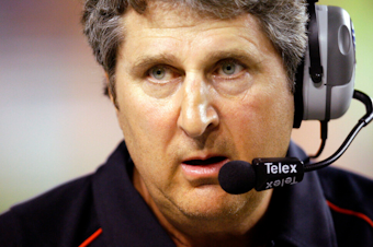 caption: Texas Tech coach Mike Leach waits as a play is reviewed during the first quarter of their NCAA college football game against Texas in Austin, Texas, Sept. 19, 2009. Mike Leach, the gruff, pioneering and unfiltered college football coach who helped revolutionize the passing game with the Air Raid offense, has died following complications from a heart condition, Mississippi State said Tuesday, Dec. 13, 2022. He was 61. 