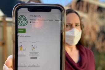 caption: Washington state residents can now enable a smartphone app that sends an alert if the user was potentially exposed to a coronavirus carrier.