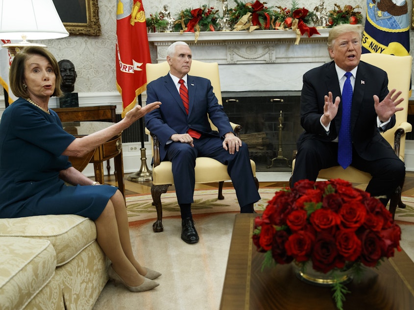 caption: Vice President Mike Pence looks on as now-House Speaker Nancy Pelosi, D-Calif., argues with President Trump during a meeting in the Oval Office last month.