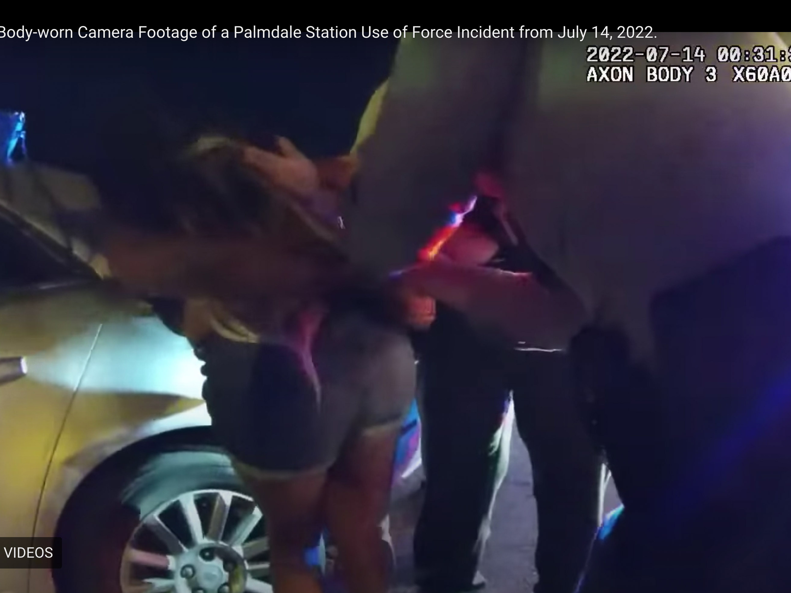 caption: A year later, the Los Angeles County Sheriff's Department has released body-worn camera footage of a July 13, 2022, incident in which one of several deputies arresting a woman at a traffic stop punched her in the face as she held her newborn baby.