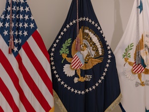 caption: The presidential flag (center) is hand embroidered.