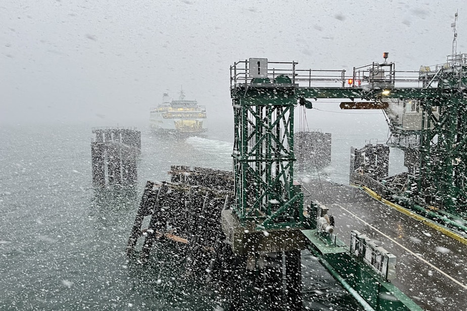 caption: A ferry departs Anacortes for the San Juan Islands on a snowy evening in February 2024