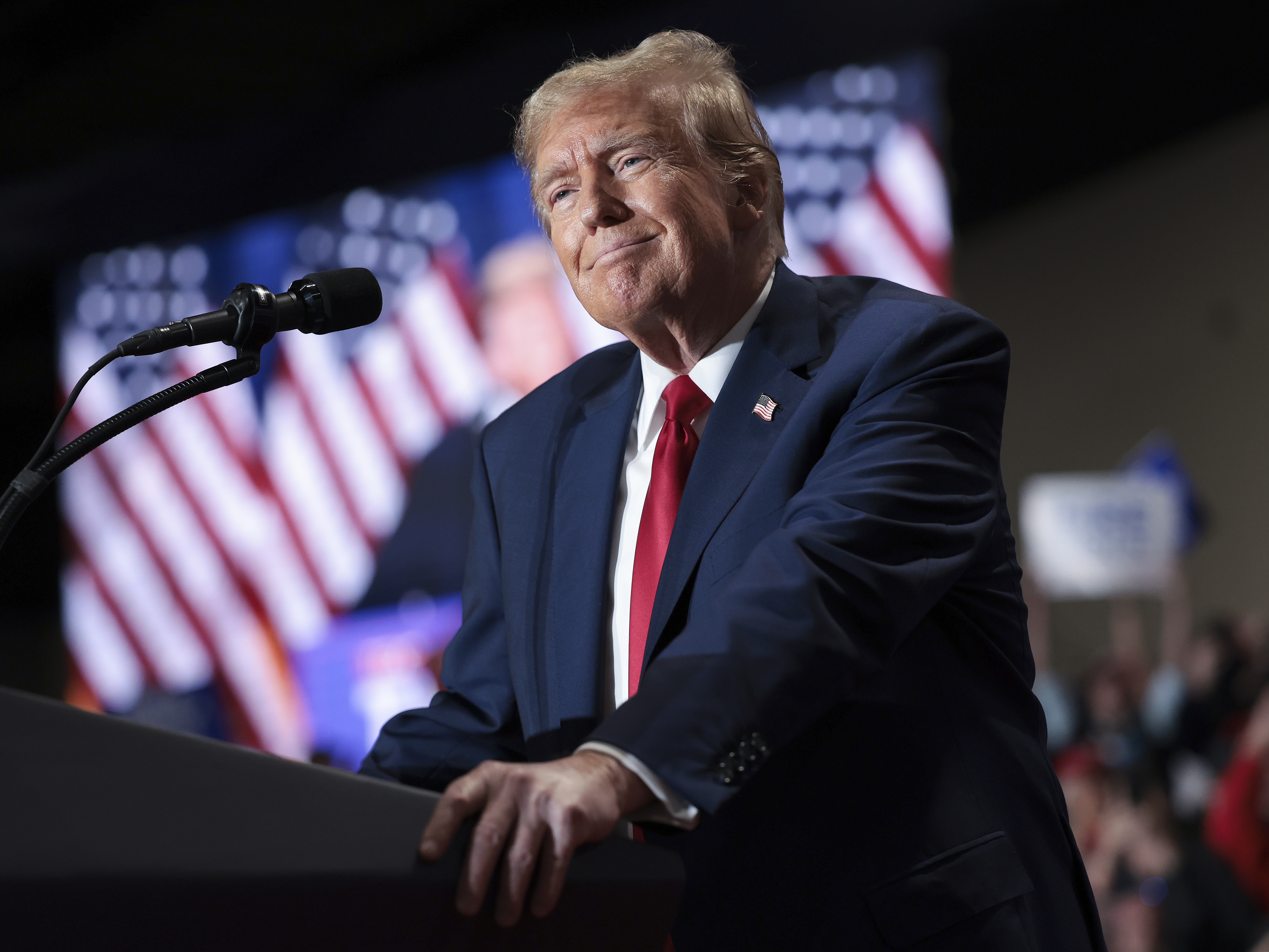 caption: Former President Donald Trump speaks during a rally in Richmond, Va., on March 2. A second Trump administration could reshape the economy, from tariffs to tax cuts.