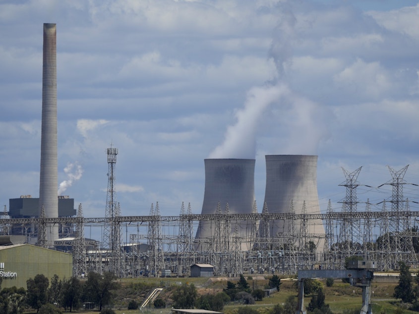 caption: The Liddell Power Station, left, and Bayswater Power Station, coal-powered thermal power station are pictured near Muswellbrook in the Hunter Valley, Australia on Nov. 2, 2021.