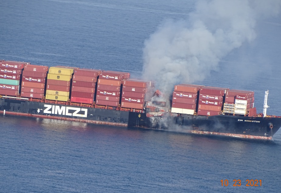 caption: Shipping containers on the M/V Zim Kingston burn in the Strait of Juan de Fuca, off Victoria, British Columbia, on Saturday.