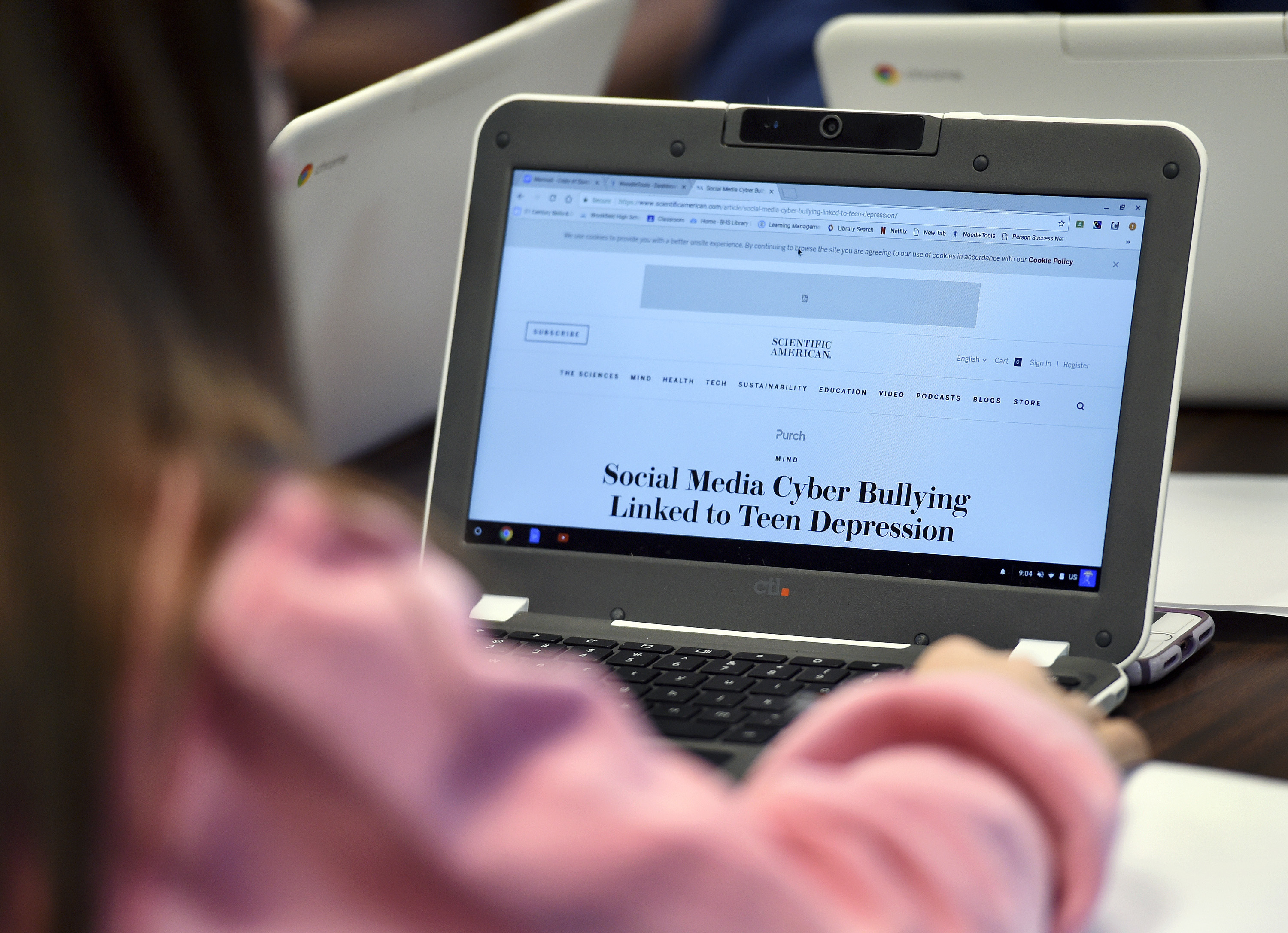 caption: In this, Dec. 20, 2017 photo, Ariana Mamudi, 14, a freshman in the Brookfield, Conn., High School Digital Student class, searches for information about Cyber Bullying. 