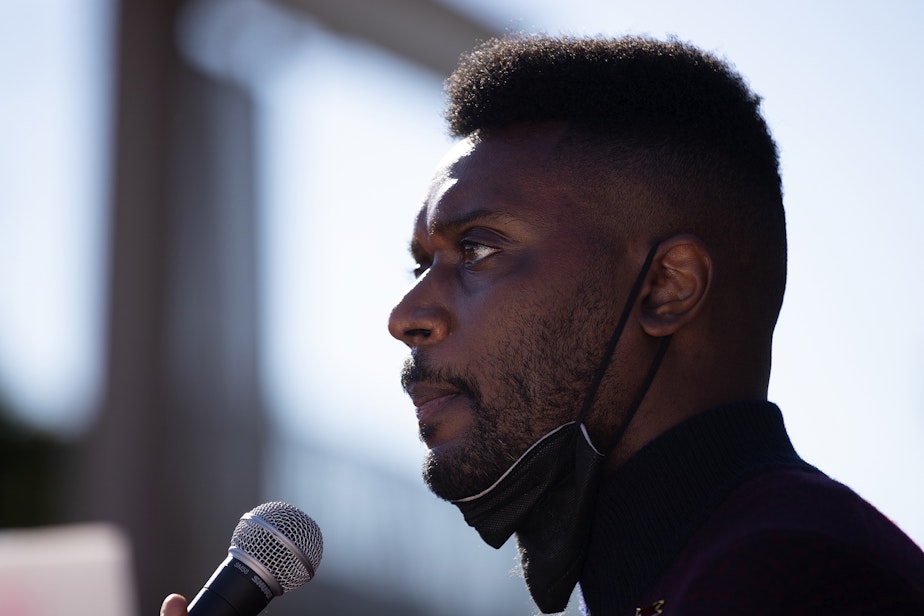 caption: In this file photo, Shaun Scott speaks to a crowd of hundreds as parents and students who rallied to demand that schools remain open, ahead of the Seattle Public Schools board meeting on Wednesday, September 18, 2024, at the John Stanford Center for Educational Excellence building in Seattle.