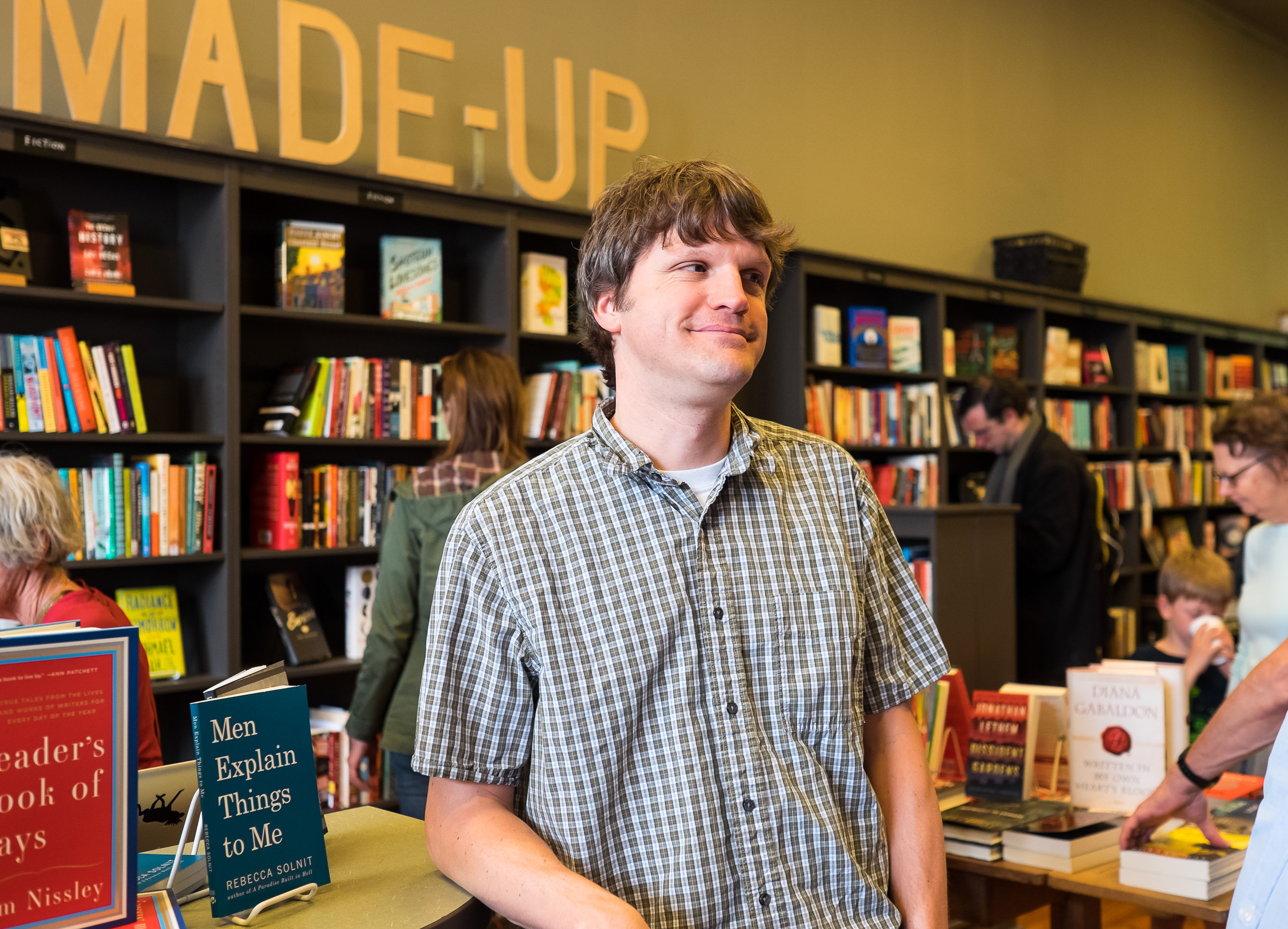 caption: Tom Nissley smiles on the opening day of his Phinney Ridge shop, Phinney Books, in June 2014.