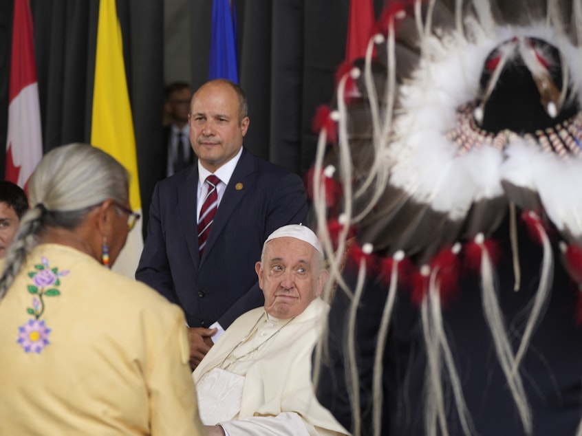 caption: Pope Francis meets the Canadian Indigenous people as he arrives at Edmonton's International airport, Canada, on Sunday.