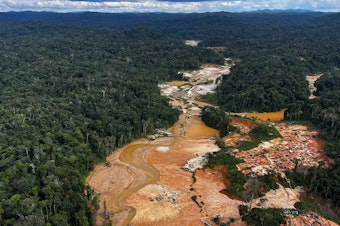 caption: An aerial picture shows an illegal mining camp during an operation by the Brazilian Institute of Environment and Renewable Natural Resources against Amazon deforestation at the Yanomami territory in Roraima state, Brazil, on Feb. 24.