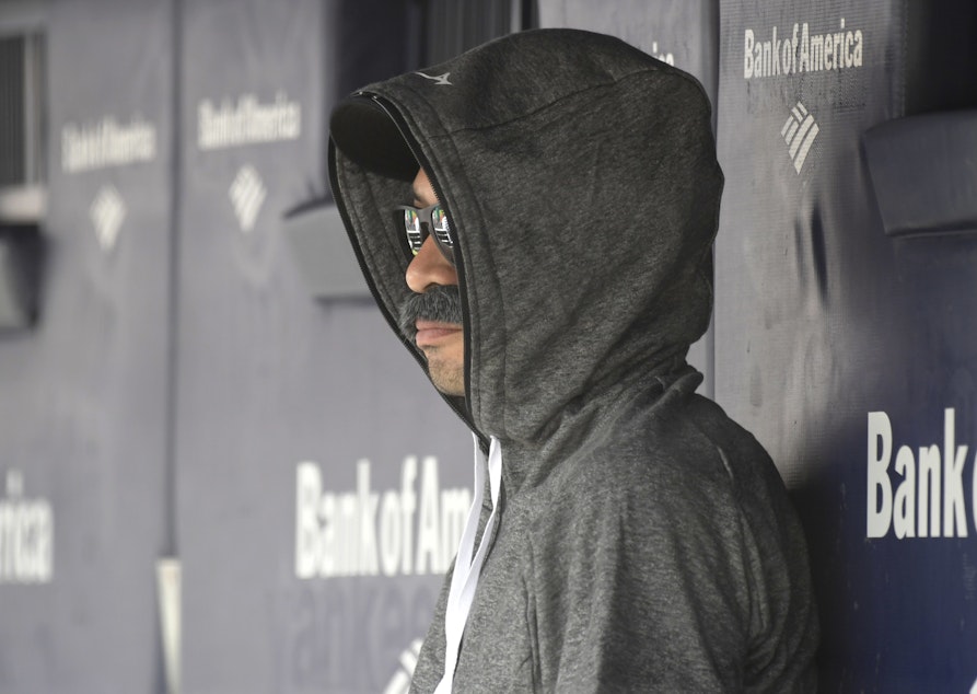 caption: Ichiro Suzuki, special assistant to the chairman of the Seattle Mariners, donned a Bobby Valentine-style disguise and sneaked into the Seattle dugout to watch a bit of the action at Yankee Stadium.
