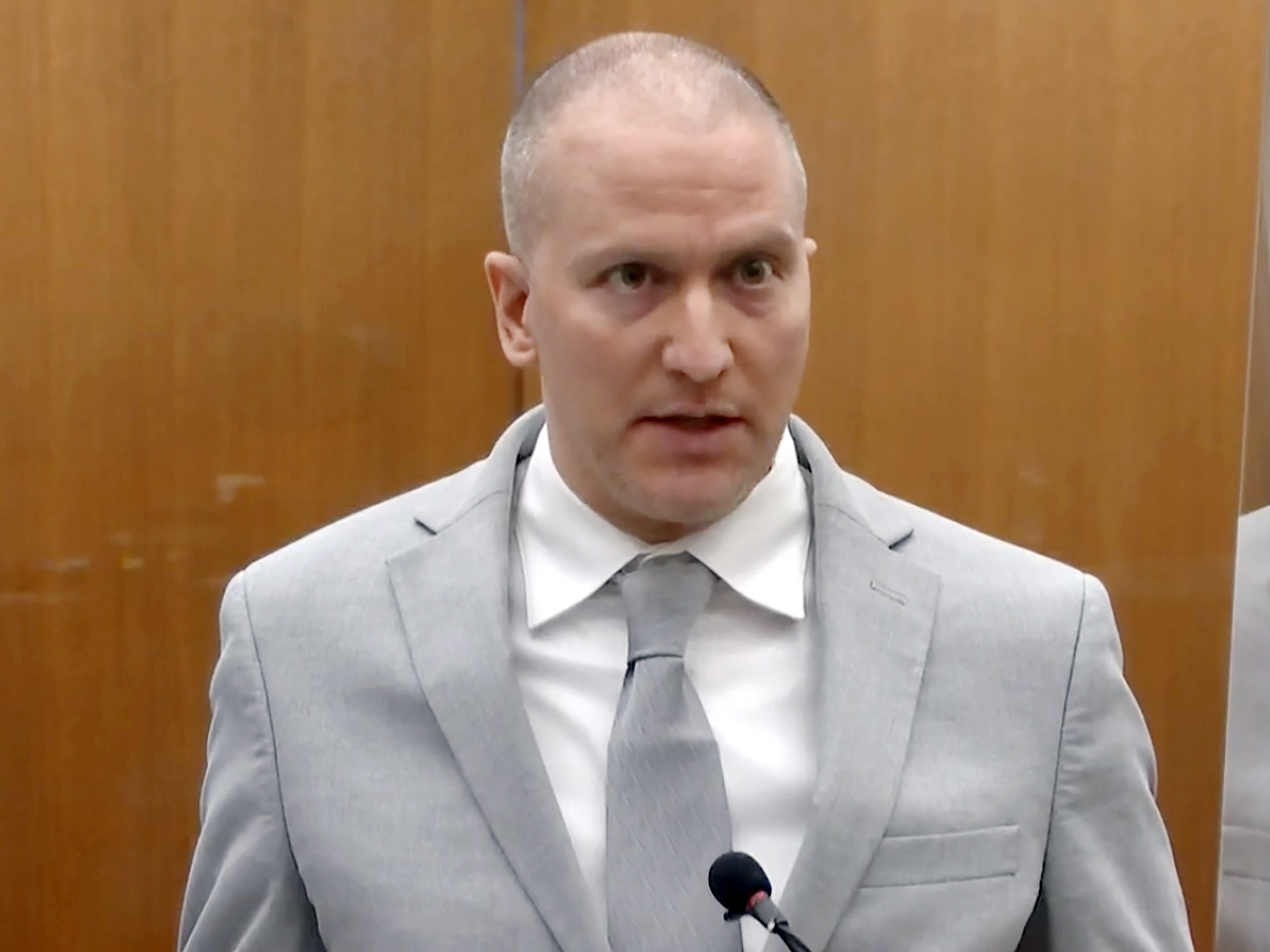 caption: In this image taken from video, former Minneapolis police Officer Derek Chauvin addresses the court at the Hennepin County Courthouse on June 25, 2021, in Minneapolis. The city of Minneapolis agreed Thursday, April 13, 2023, to pay nearly $9 million to settle lawsuits filed by two people who said Chauvin pressed his knee into their necks years before he used the same move to kill George Floyd.