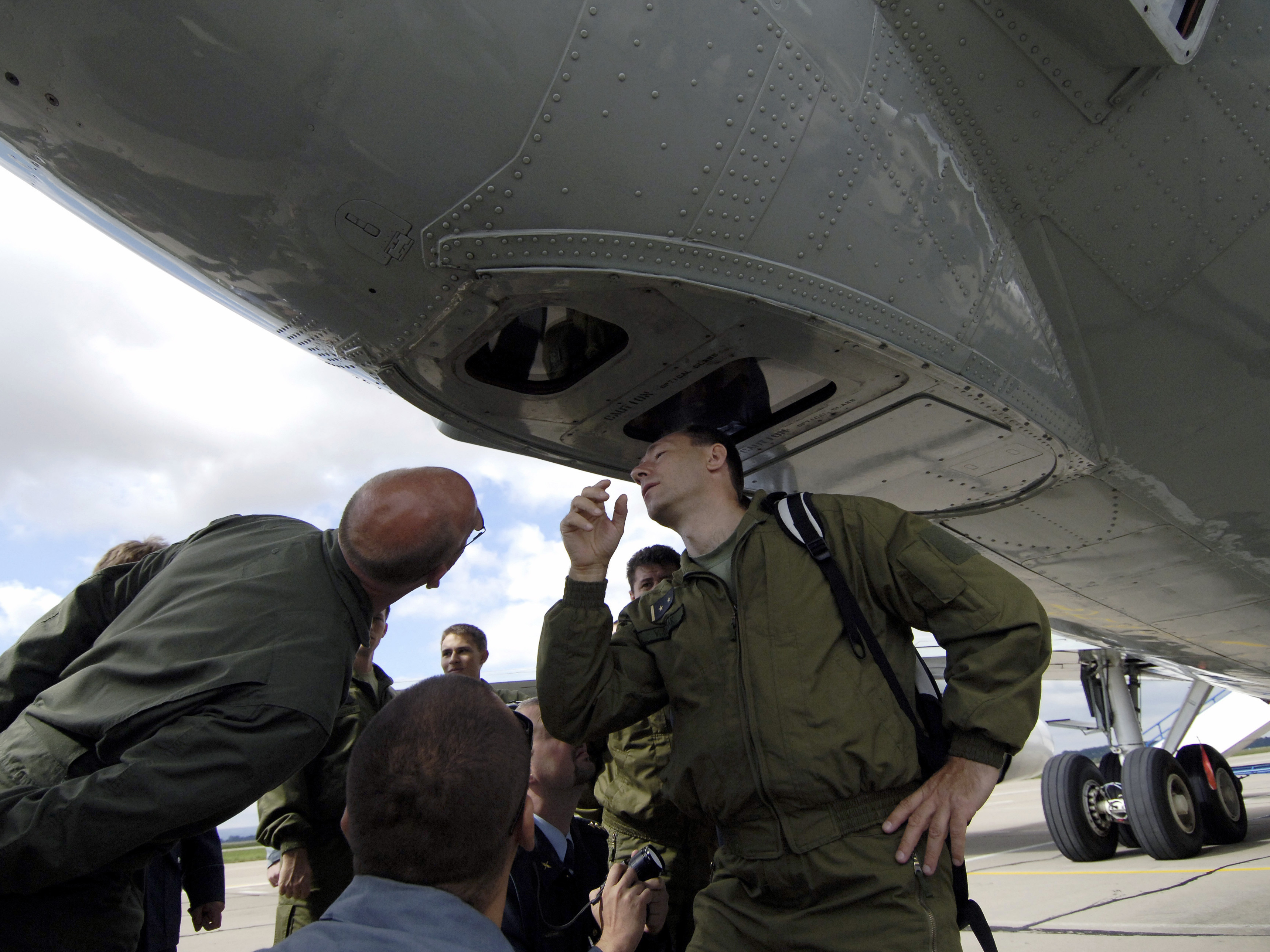 caption: Open Skies would be the third major international military pact Trump has withdrawn the U.S. from. This photo from 2007 shows Czech soldiers inspecting cameras on a U.S. Boeing plane at a military airbase in Pardubice, Czech Republic, as part of the agreement.