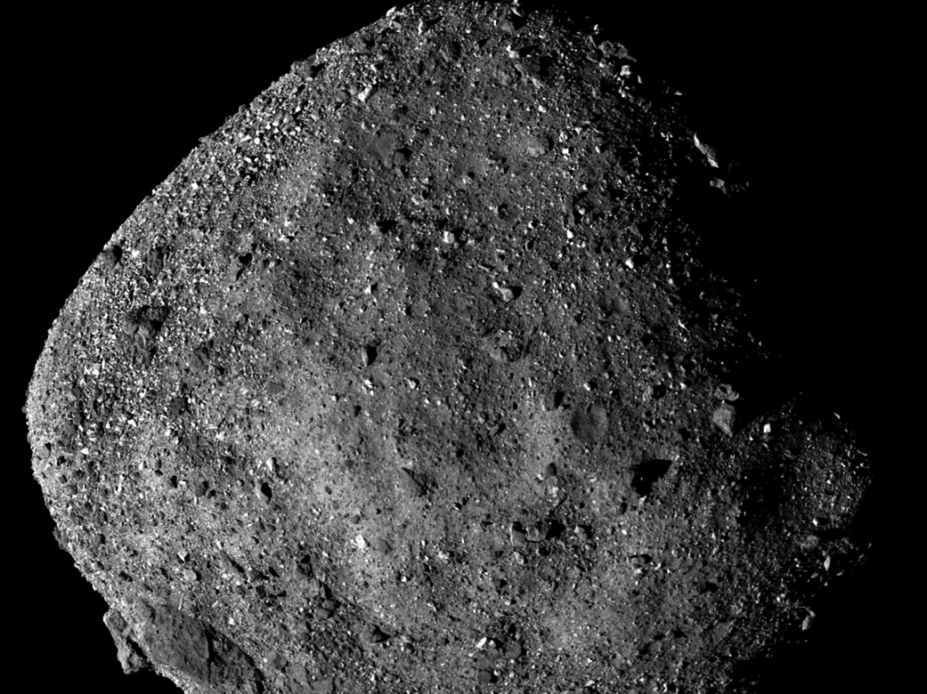 caption: This image of Bennu, taken from a range of 15 miles, shows its unexpectedly rough and rocky surface.