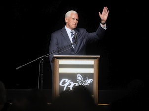 caption: Former Vice President Mike Pence speaks at a fundraiser for Carolina Pregnancy Center on May 5 in Spartanburg, S.C. Pence will campaign with Georgia's incumbent Republican Gov. Brian Kemp the day before this month's GOP primary in his most significant political beak with former President Donald Trump to date.