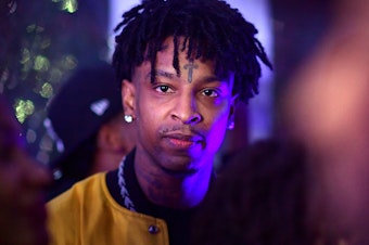 caption: Rapper 21 Savage attends an event related to his new album, "I Am > I Was," in Atlanta. The rapper, whose real name is Sha Yaa Bin Abraham-Joseph, was arrested Sunday by U.S. Immigration and Customs Enforcement.