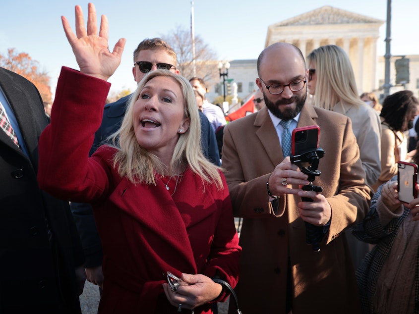 caption: Rep. Marjorie Taylor Greene, R-Ga., joins fellow anti-abortion activists in front of the U.S. Supreme Court as the justices hear hear arguments in Dobbs v. Jackson Women's Health, a case about a Mississippi law that bans most abortions after 15 weeks, on Dec. 1, 2021 in Washington, D.C.