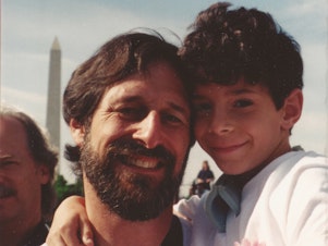 caption: Alan Stepakoff with his son, Josh, in Washington, D.C., for the Million Mom March rally in May 2000, the year after Josh was shot at his Jewish day camp.