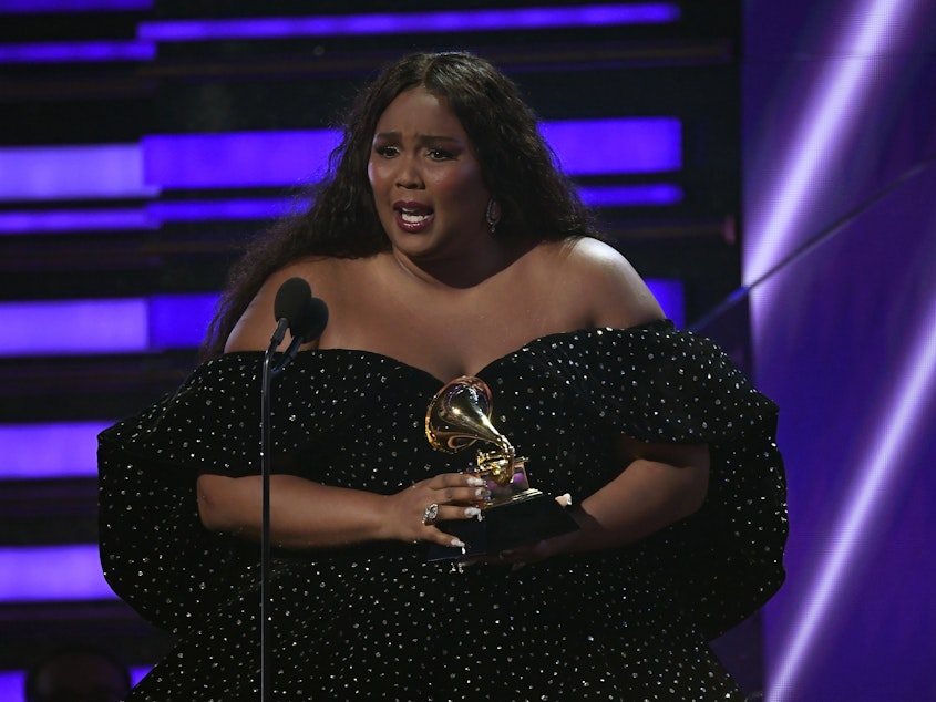 caption: Lizzo accepts the award for Best Pop Solo Performance at the 62nd annual Grammys in Los Angeles on Jan. 26, 2020.