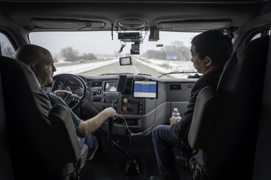 caption: Andrew Yang with a Truck Driver in Altoona, Iowa  