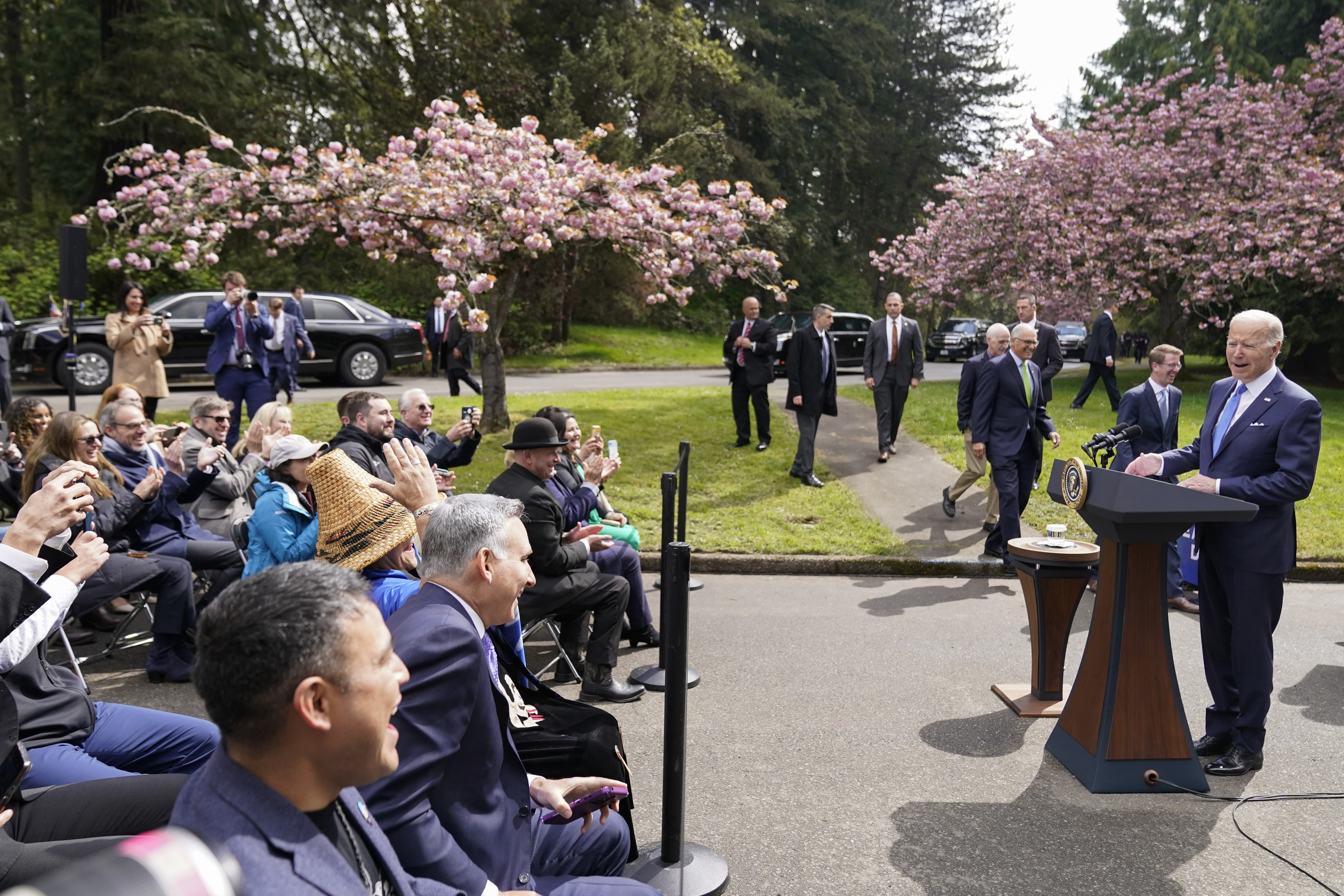 caption: President Joe Biden speaks at Seward Park on Earth Day, Friday, April 22, 2022, in Seattle. 