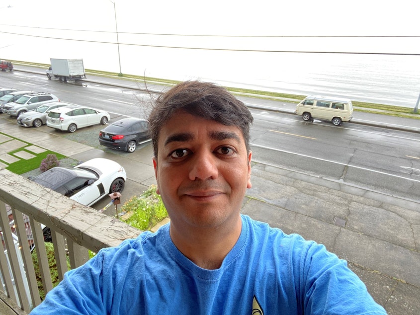 caption: Archis Gore is planning to move out of West Seattle, now that the main bridge is out, so he can better reach his cybersecurity job in Bellevue.