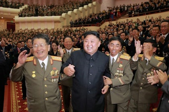 caption: North Korean leader Kim Jong Un at a celebration for scientists and engineers who contributed to the nation's latest nuclear test.