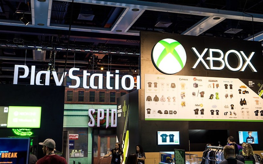 caption: Play station and XBOX displays at PAX West 2018. 