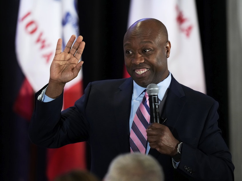 caption: Sen. Tim Scott, R-S.C. speaks during the Republican Party of Polk County Lincoln Dinner on Feb. 22 in West Des Moines, Iowa.