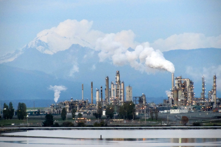 caption: Oil refineries on Puget Sound, like this one in Anacortes, Washington, distribute gasoline and diesel both in-state and out-of-state, the latter of which could carry an extra tax starting next year.