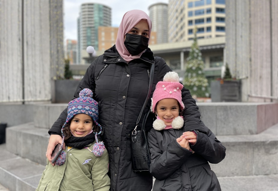 caption: Nahla Shouh in Westlake Park is shopping with her children