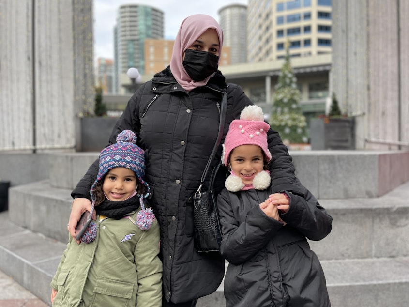 caption: Nahla Shouh in Westlake Park is shopping with her children