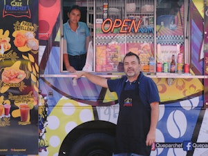 caption: Paulo Echeverry and Dahianara Lopez Zapata, at their food truck in Kissimmee, Fla.