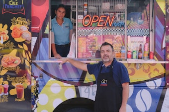 caption: Paulo Echeverry and Dahianara Lopez Zapata, at their food truck in Kissimmee, Fla.