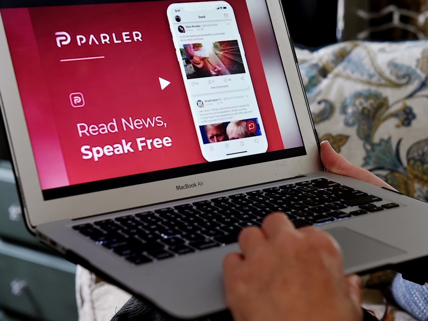 caption: Parler bills itself as a "free speech" social network and puts few restrictions on what users can post.