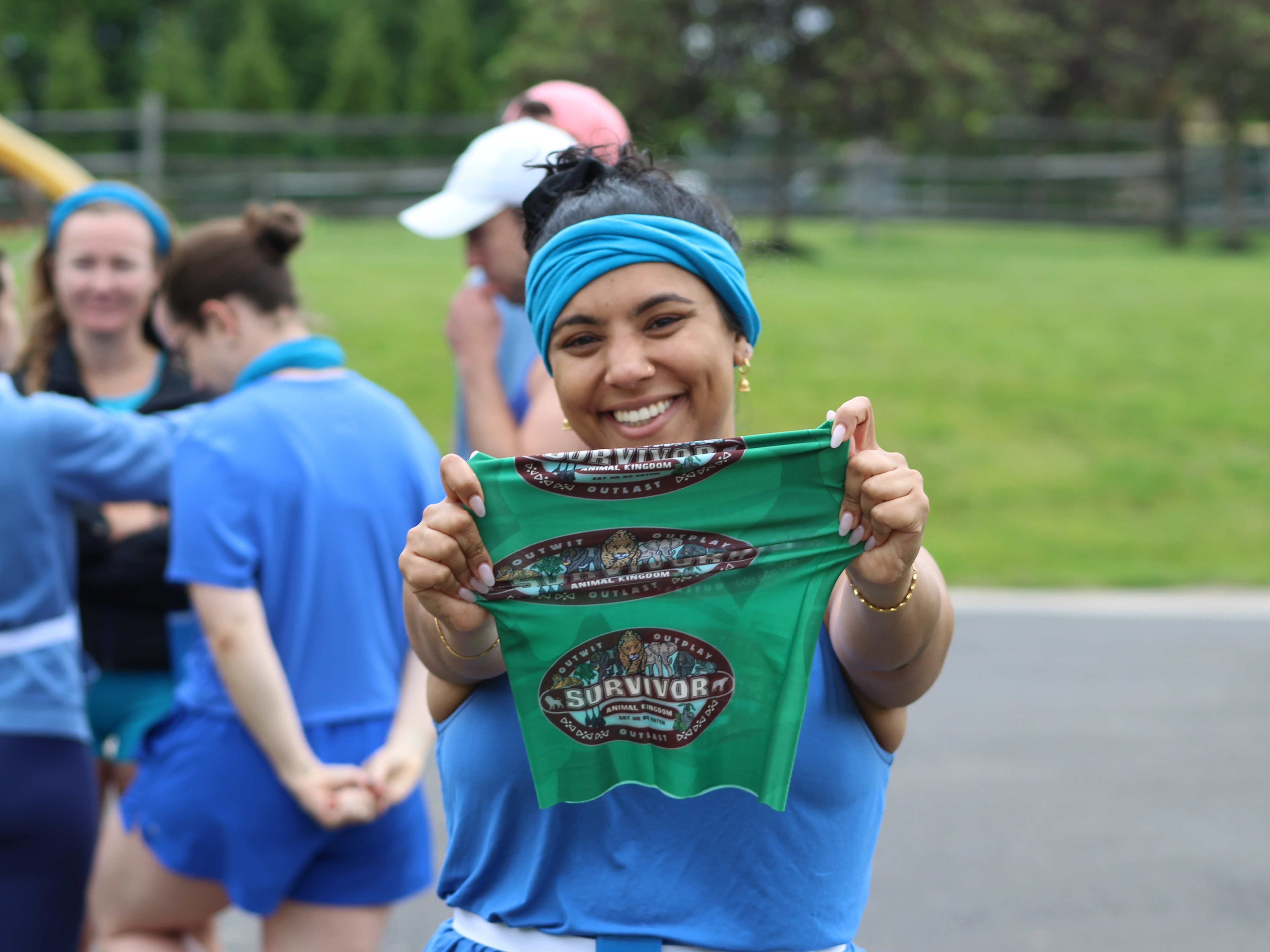 caption: <em>All Things Considered</em> producer Mia Venkat holding up the "buff" her friends made for their <em>Survivor </em>games.