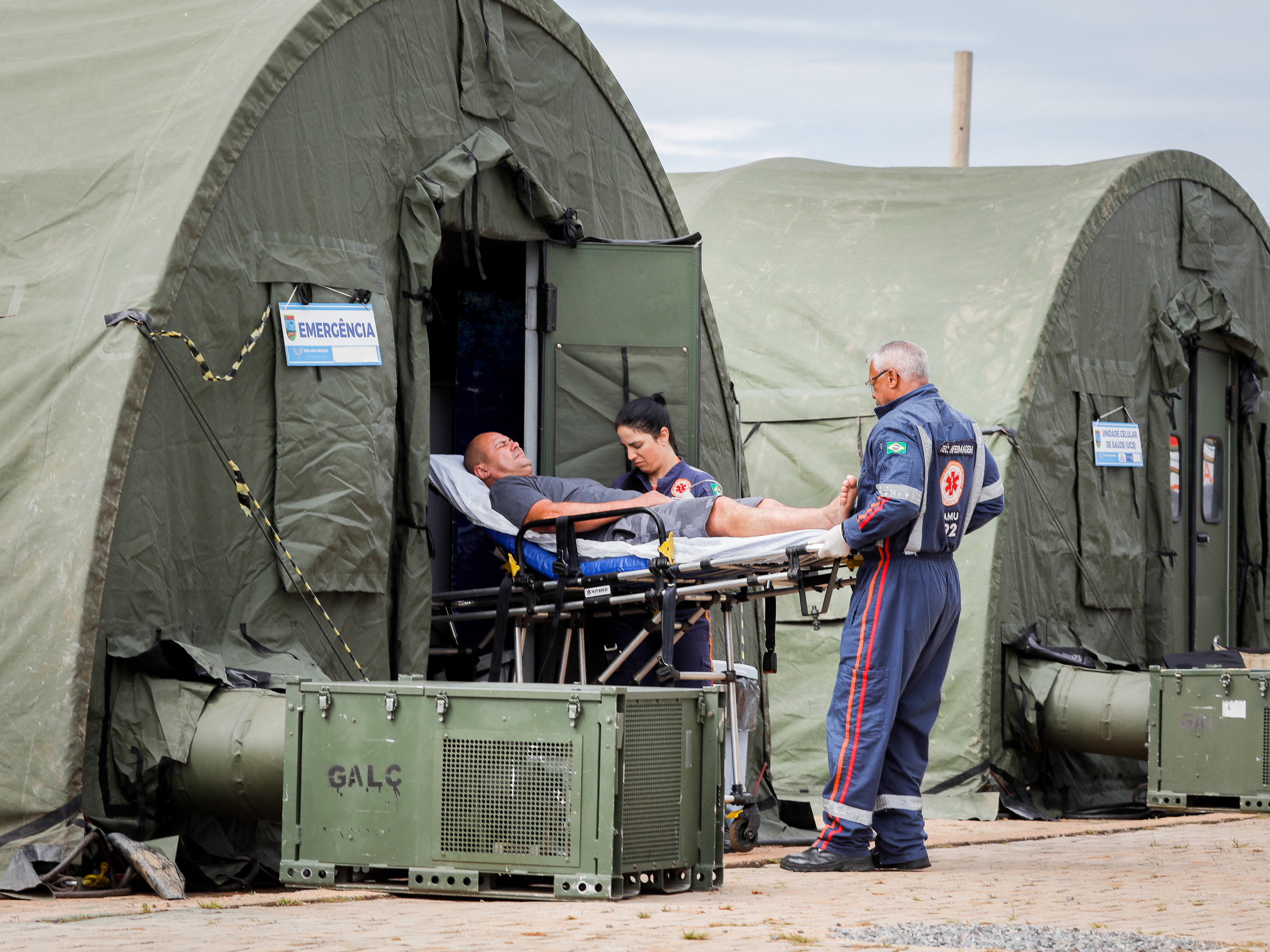 caption: A patient is transferred to a hospital after receiving medical care at an improvised military aid station set up to treat suspected cases of dengue fever in the administrative region of Ceilandia, on the outskirts of Brasilia, on February 6, 2024.