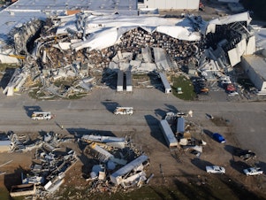 caption: A tornado damaged a Pfizer pharmaceutical plant in Rocky Mount, N.C., in July. The facility makes almost 25% of Pfizer's sterile injectable medicines used in the U.S.