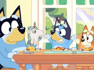 caption: Bandit (left) with his daughters Bluey (center) and Bingo (right).