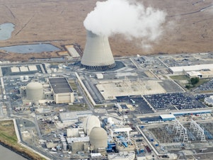 caption: An aerial view of the Salem Nuclear Power Plant and Hope Creek Nuclear Generating Station situated on the Delaware River in Lower Alloways Township, New Jersey.